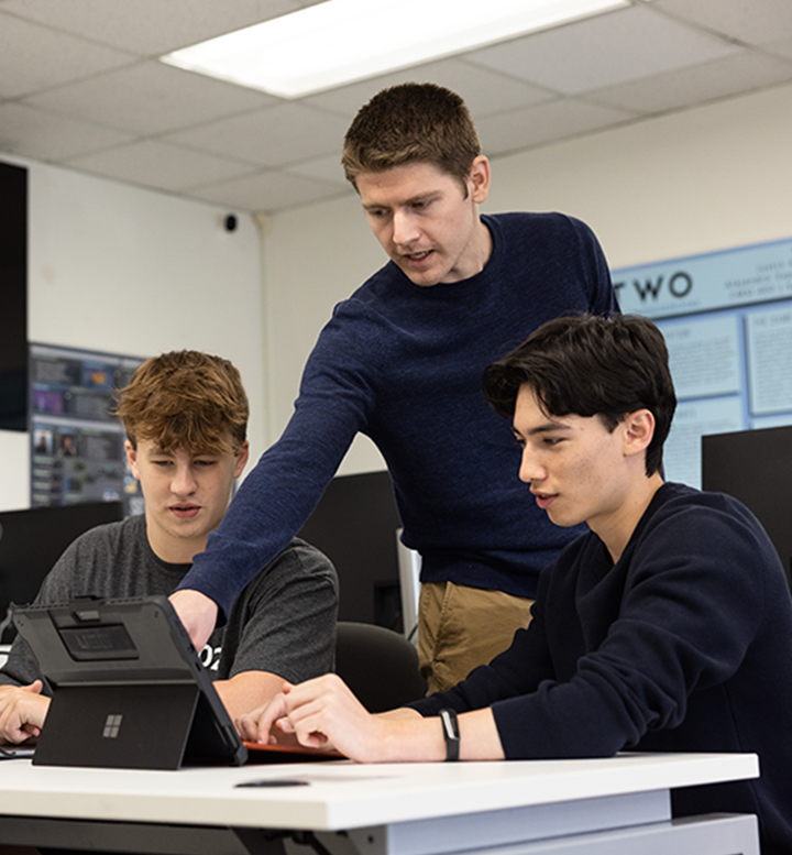 LMU Professor Jared Coleman works with students