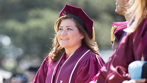 A graduate student during procession into Sunken Garden