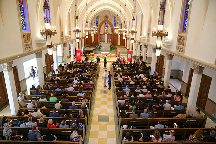 Interior of Sacred Heart Chapel with all seating filled