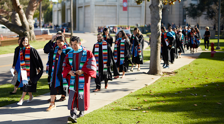 Students walking in line to Latinx gradution