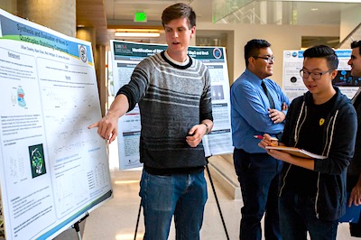 McNair Scholar giving poster presentation